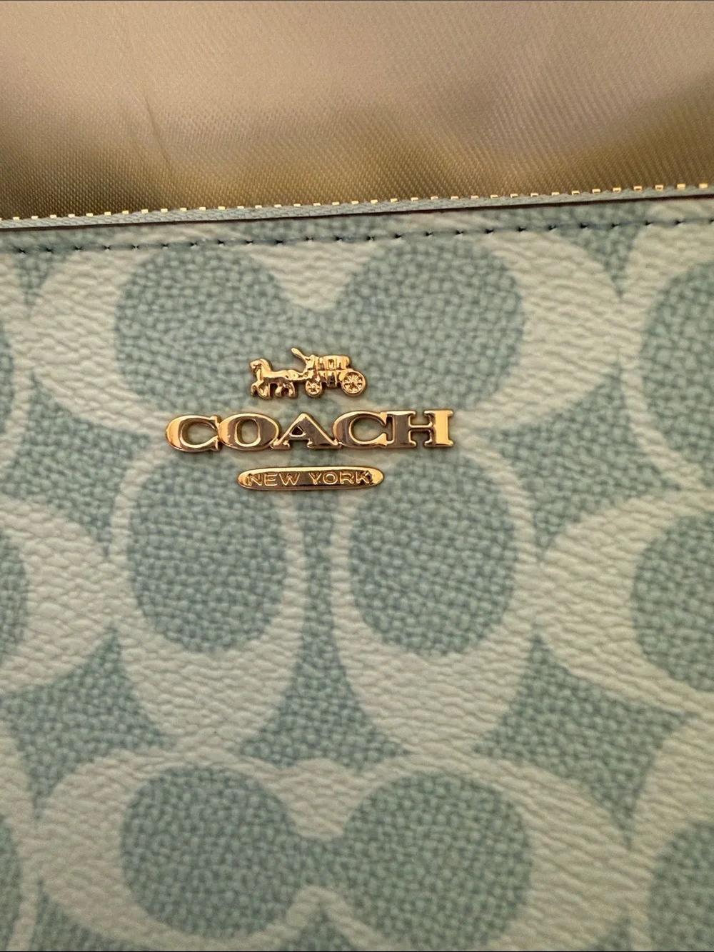 Coach wristlet featuring